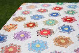 It is a traditional coverlet design. Antique Grandmother S Flower Garden Quilt