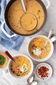 Tender chunks of baked potato in a rich cheese soup are garnished with cheddar cheese, bacon crumbles and chives. Creamy Potato Soup Recipe Love And Lemons