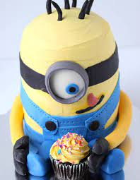 Layer the three round cakes by placing them on top of each other with a layer of frosting in. Making A Minion Cake Beyond The Oven A Classic Twist