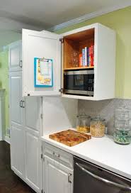 Hanging A Clipboard In A Cabinet To Organize Takeout Menus Young House Love Microwave Cabinet Built In Microwave Cabinet Microwave In Kitchen