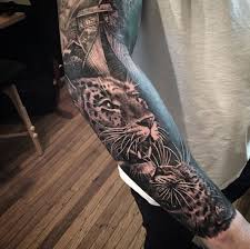 The strength and power behind the tattoo adds to this wonderful sleeve of tattoos. Black Ink Jaguar Tattoo On Right Arm