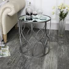 A glass coffee table makes for an elegant, subtle addition to the room, while a coffee table with storage is perfect for creating space for a striking centerpiece. Small Ornate Silver Mirrored Side Table