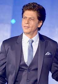 Invincible and charismatic shah rukh khan for #dabbooratnanicalendar @iamsrk. the picture, which was a top angle close up shot of shah rukh, had him posing shirtless, with only his shoulders and face visible in the photo. Shah Rukh Khan Wikipedia
