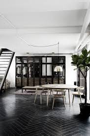 How To Pull Off The Hip Industrial Look All Our Editors Are Obsessed With Black Wood Floors Industrial House Loft Interiors