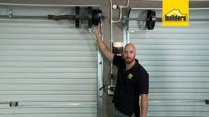 Next is we attach the head stops making sure that it is securely placed. How To Automate A Roll Up Garage Door Youtube