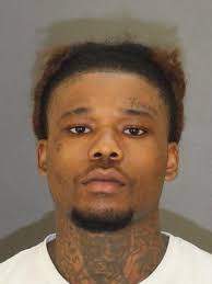 Man arrested in connection to shooting that caused woman's car to flip over