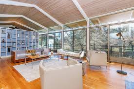 The frame is painted steel with aluminum sliding glass doors. On The Market A Midcentury Modern Home In Dedham With A Greenhouse