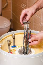 How to change heating element in water heater. Boiler Repair Replacement Of Broken Water Heating Element Stock Photo Picture And Royalty Free Image Image 108715361