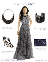 A black tuxedo for the groom and an airy ivory gown and veil for the bride. Black Tie Optional Wedding Attire Long Gown For Wedding Guest