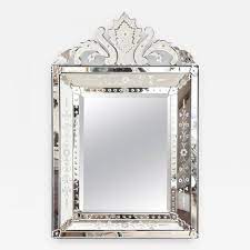Venetian mirror has beautiful hand etched design with elaborate multidimensional floral pattern with scrolled leaf motif. A Venetian Etched Glass Mirror