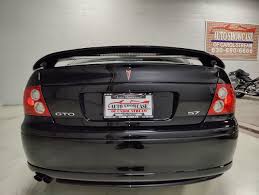 Image result for Dark Otter Gray 2004 Pontiac