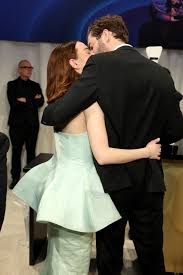 Emma Stone & Husband Dave McCary Show Rare PDA With Oscars Party Kiss