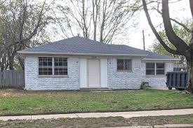 White brick and limestone house. How To Limewash Your Brick House Olive June