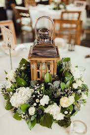 Wedding flower arrangements go beyond the basic centerpieces and bouquets. Simple Rustic Cosy Winter Wedding Winter Table Centerpieces Winter Wedding Centerpieces Table Centerpiece Decorations