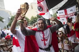 A euro 2020 fan fell 20ft from wembley's upper tier onto concrete after 'trying to fix a flag' during england's opening game of the tournament. Hurrah An England Fan Dressed As St George Holds Aloft A Replica Of The World Cup England Fans England Football England Football Team