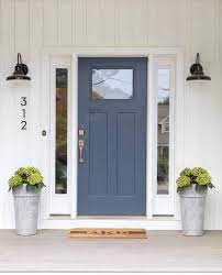 This whimsical color choice is cheerful and fun. White House With Blue Doors Novocom Top
