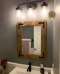 Add a matching mason jar light fixture. Handmade Farmhouse Rustic Lighting And Home Decor By Lulight Rustic Bathroom Light Fixtures Bathroom Mirror Rustic Bathroom Lighting