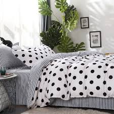 A white and black plaid roman shade hangs from a window positioned over white velvet twin beds boasting a shared moss green velvet headboard. Beautiful Modern Chic Hot Pink Black White Polka Dot Stripes Soft Comforter Set