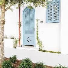 Where do you need exterior shutters install pros? Blue Arch Door With Shutter Trim Cottage Deck Patio Garage Door Styles Window Trim Exterior Shutters Exterior