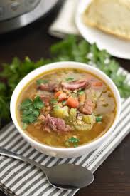 Instant Pot Ham And Lentil Soup With Carrots And Celery In White Bowl Ham And Lentil Soup Lentil Soup Recipes Ham Bone Recipes