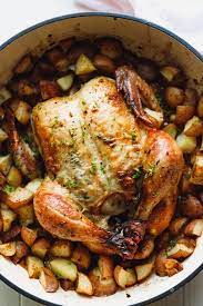 Whole Roasted Chicken With Potatoes In A Dutch Oven Easy To Make With A Crispy Golden Sk Whole Chicken Recipes Oven Oven Chicken Recipes Whole Roasted Chicken
