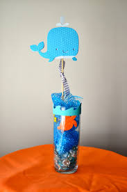 Decorations for a whale baby shower theme consist of lots of blues and pastel colors, along with images of all sorts of nautical and under the sea things. Boy Whale Themed Baby Shower Novocom Top