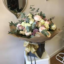 Think of her/his favorite flowers. Handtied Bouquets Holly Ivy Flowers