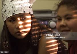 Jenna Pagaling listens to Katy Miranda during youth council meeting....  News Photo