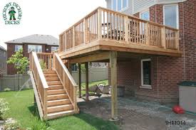 It has cantilevered nooks on both sides that provide space for seating and barbecue storage. High Diy Deck Plans