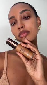 Essentials that do all the work. @Jasmine Tookes shows how she achieves an  even, airbrushed complexion by mixing Ambient Soft Glow Foundation in  shades 13 and 14. #AmbientGlow #HourglassCosmetics