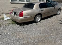 Image result for Medium Gold 1998 Town Car