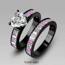 The Black Gold Makes The Heart Pop The Pink Sapphires Are An Excellent Complement Black Engagement Ring Black Wedding Rings Black Gold Jewelry