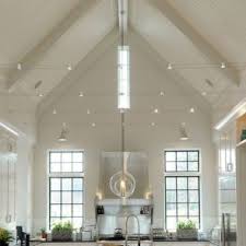 While high ceilings are architecturally appealing, they present challenges for installing light fixtures, so consider these vaulted ceiling lighting options. How To Illuminate Vaulted Ceilings With Some Key Lighting Tips Litecraft Vaulted Ceiling Lighting Ceiling Light Design Bedroom Ceiling Light