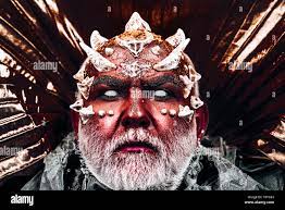 Devil sitting on golden throne. Evil monster with burning red skin and  thorns on face appearing from darkness, nightmare concept Stock Photo -  Alamy