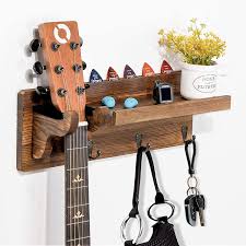 5 out of 5 stars. Buy Ourwarm Guitar Wall Hanger Guitar Holder Wall Mount Ukulele Wall Mount Guitar Stand Wood Hanging Rack With Guitar Accessories Storage Shelf And 3 Hooks Online In Indonesia B08shwt429