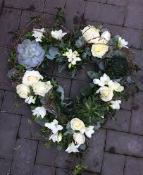 Textured Open Heart Using Succulents Roses Freesia Honeysuckle And Spanish Moss Funeral Flowers Floral Wreath Flowers