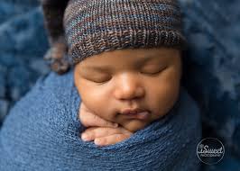 Sleeping baby boy in blue