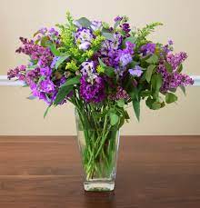 Shades Of Purple In A Flower Arrangement Lilac Stock Lisiantus Foliage Arrangements Fresh Flowers Arrangements Flower Arrangements