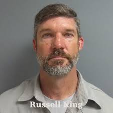 A Kentucky man was taken into custody after he allegedly rear-ended an  officer at a red light at around 3 a.m.