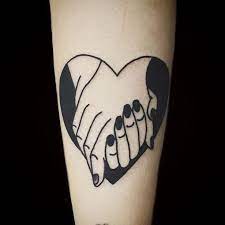 What is more romantic than a tattoo? 12 Romantic Tattoos To Keep The Passion Alive Romantic Tattoo Tattoos Hand Holding Tattoo