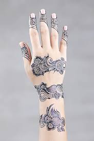 An ornate gold design wraps around the wearer's wrist and descends down onto the wearer's index finger in this henna tattoo. Mehndi Design Mehendi Training Center Tattoo Arabic Henna Designs For Hands Pikist