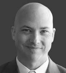 J. Wade Ellison, COO, CCO