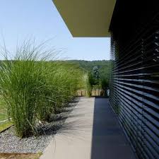 Minimalist Garden Design On A Slope With Corten Steel Pools And Fe In 2020 Minimalist Garden Modern Garden Design Modern Garden