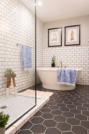 This modern rustic bathroom features beautiful charcoal wall tile, brightened up by the white grout. Bathroom Subway Tile Trendecors
