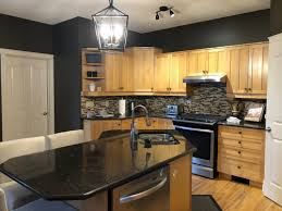 Dark hardwood floors also work to anchor the room. Wall Color To Match Maple Kitchen Cabinets