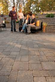 Outcropping | barkman concrete ltd. Barkman S Roman Pavers In Sierra Grey Act As The Structural Base For The Huge Patio Outlined By A Row Of Desert Buff 8x4 Patio Makeover Stone Paver Patio Patio