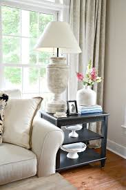 How To Style An End Table 5 No Fail Items To Put On Your End Table Living Room End Table Decor Table Decor Living Room Living Room End Tables
