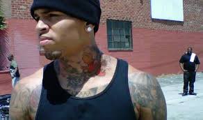 Chris brown's new tattoo is not an image of rihanna or an abused woman, his publicist told ew. Chris Brown Adds Ink Of Lion To His Neck Singersroom Com