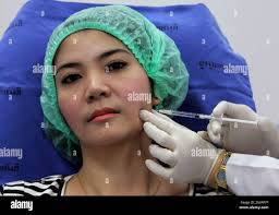 In this Oct. 17, 2012 photo, a 32-year-old Thai woman, Nisakron Boonpun  gets a Botox injection at Bangkok's Yanhee Hospital, which houses one of  the country's best-known and largest beauty clinics. Bangkok