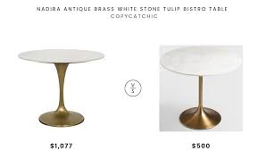 Daily Find Nadira Antique Brass White Stone Tulip Bistro Table Copycatchic Bistro Table Tulip Dining Table Pretty Furniture